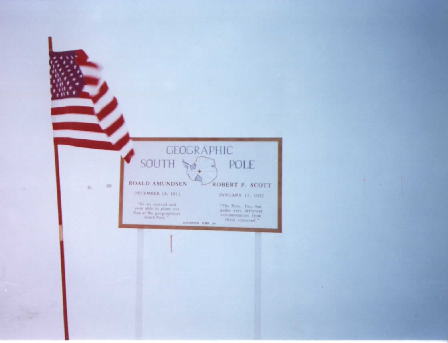 The Geographic South Pole marker with the American flag