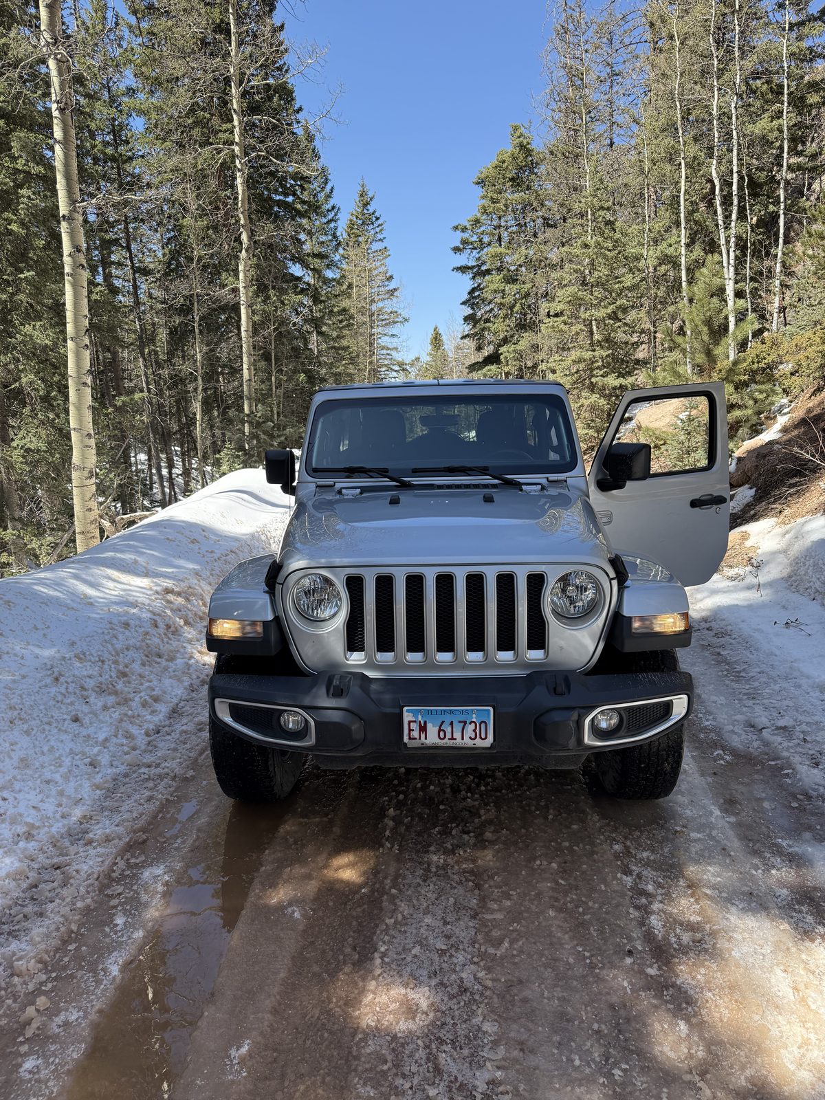 The rental Jeep Sahara on a snowy mountain road
