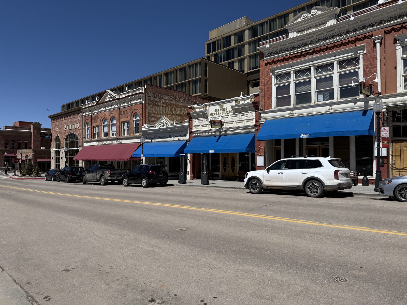 Brick buildings with blue awnings