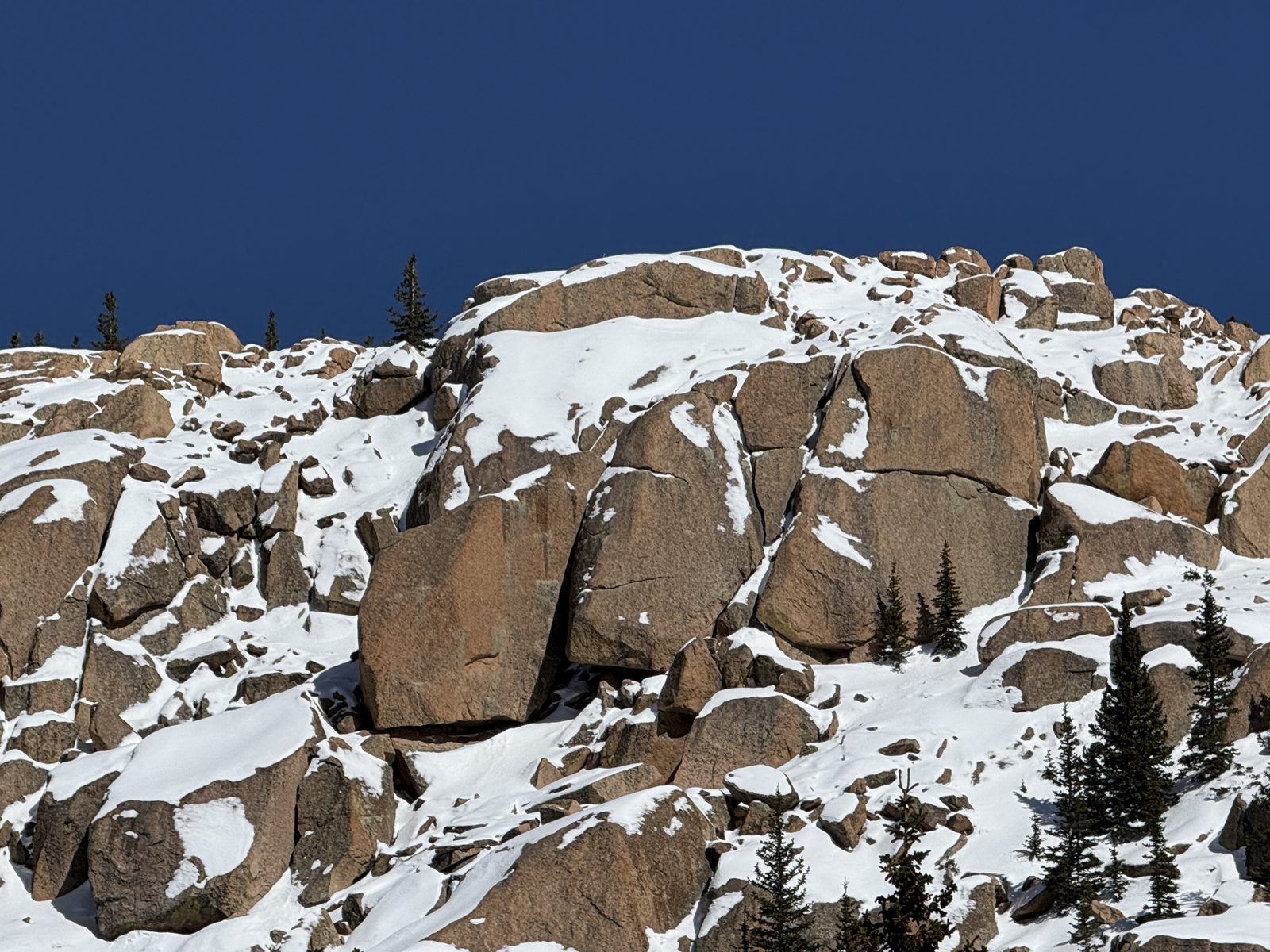 Snow-covered summit rocks