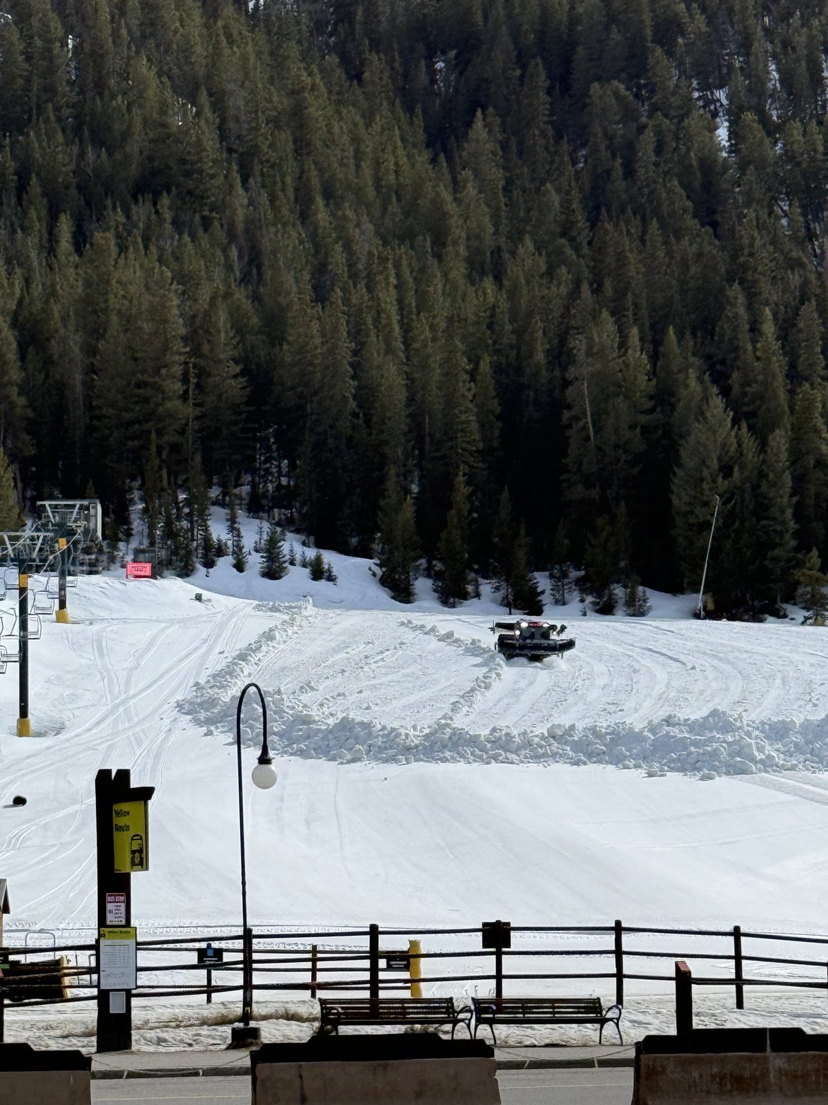 Chairlift above a groomed run