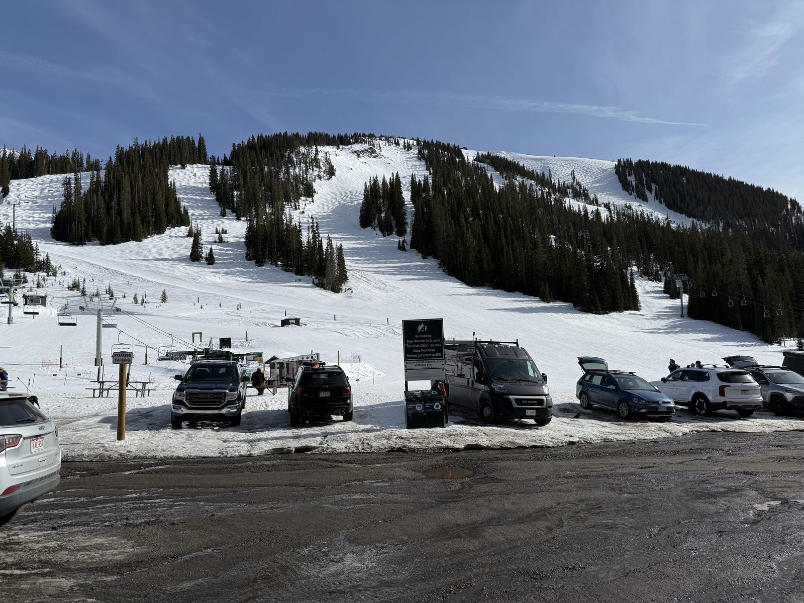 Slopes rising directly above the parked cars